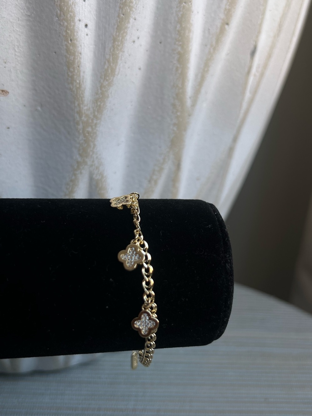 Gold clover charm bracelet with pavé detailing